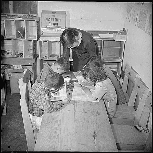 Manzanar Relocation Center, Manzanar, California. A scene in the third grade class ... 02/10/1943
